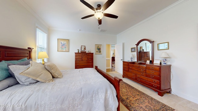 bedroom with ornamental molding, light colored carpet, ceiling fan, and baseboards