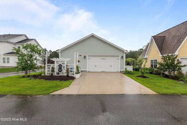 view of front of home featuring a front yard and a garage