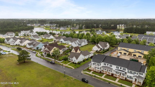 aerial perspective of suburban area featuring a nearby body of water