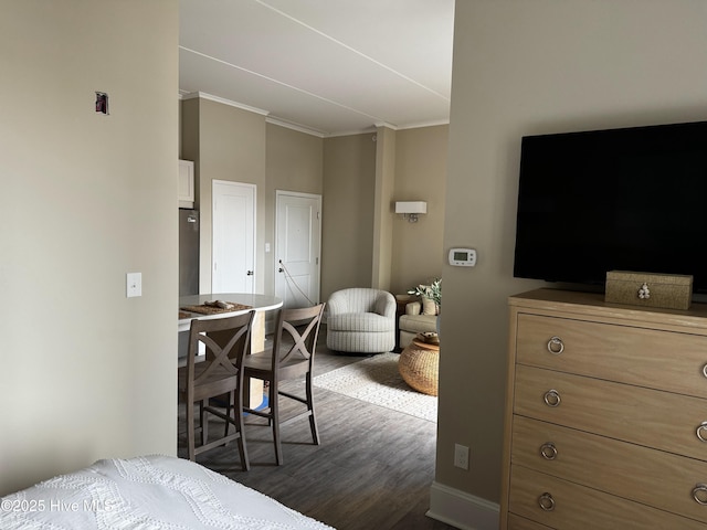 bedroom featuring dark wood-style flooring and ornamental molding