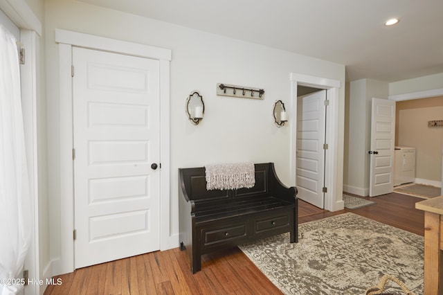 297 Broad St, Oriental, NC 28571 - hallway with washer / dryer, recessed lighting, wood finished floors, and baseboards