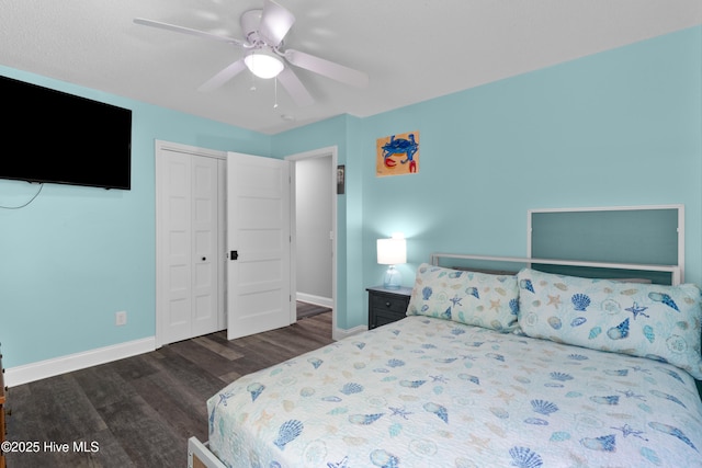 205 Sand Dollar Ln, Hampstead, NC 28443 - bedroom with wood finished floors, baseboards, a closet, and a ceiling fan