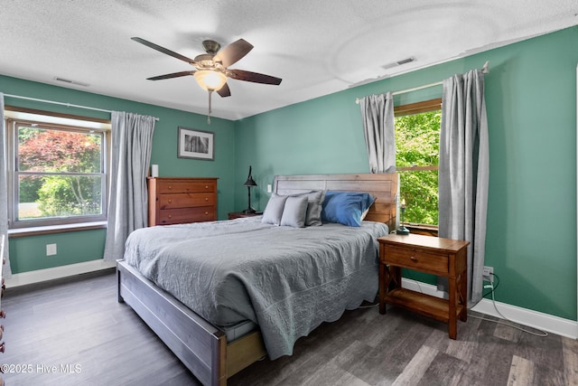205 Sand Dollar Ln, Hampstead, NC 28443 - bedroom featuring wood finished floors, baseboards, a textured ceiling, and ceiling fan