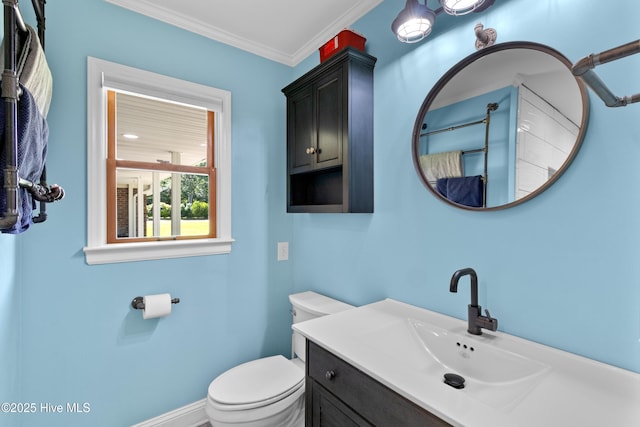 205 Sand Dollar Ln, Hampstead, NC 28443 - bathroom featuring toilet, vanity, and ornamental molding