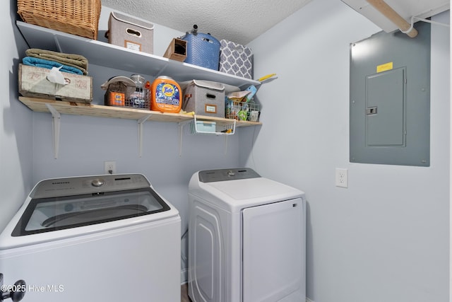 205 Sand Dollar Ln, Hampstead, NC 28443 - washroom with electric panel, separate washer and dryer, and a textured ceiling