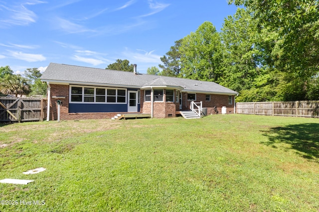 205 Sand Dollar Ln, Hampstead, NC 28443 - back of house featuring a sunroom and brick siding