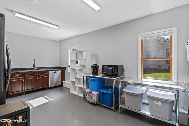 205 Sand Dollar Ln, Hampstead, NC 28443 - miscellaneous room with a sink, plenty of natural light, and concrete floors
