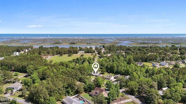 205 Sand Dollar Ln, Hampstead, NC 28443 - aerial perspective of suburban area featuring a nearby body of water and a tree filled landscape