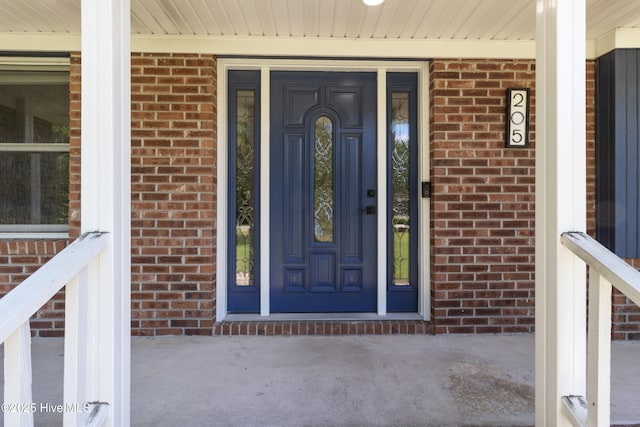 205 Sand Dollar Ln, Hampstead, NC 28443 - entrance to property featuring brick siding and covered porch