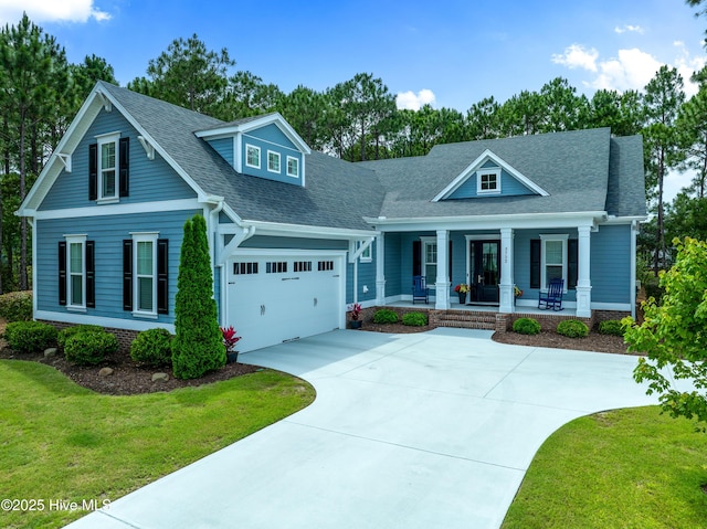 3752 Glenmere Ln, Southport, NC 28461 - view of front of home featuring a porch, concrete driveway, a front lawn, an attached garage, and a shingled roof