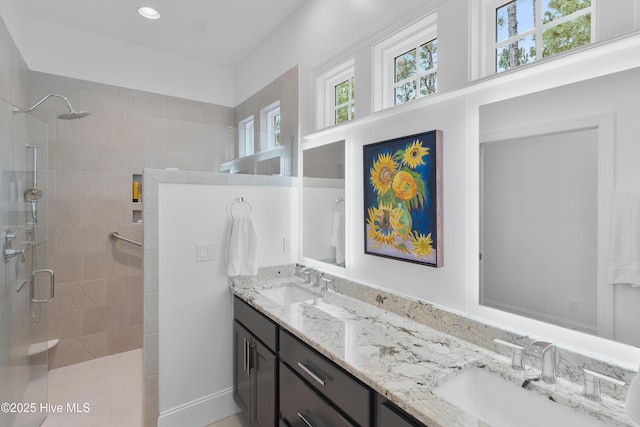 3752 Glenmere Ln, Southport, NC 28461 - bathroom featuring a tile shower, double vanity, plenty of natural light, and recessed lighting