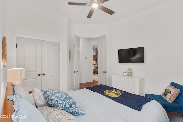 3752 Glenmere Ln, Southport, NC 28461 - bedroom featuring a closet, ceiling fan, baseboards, and wood finished floors