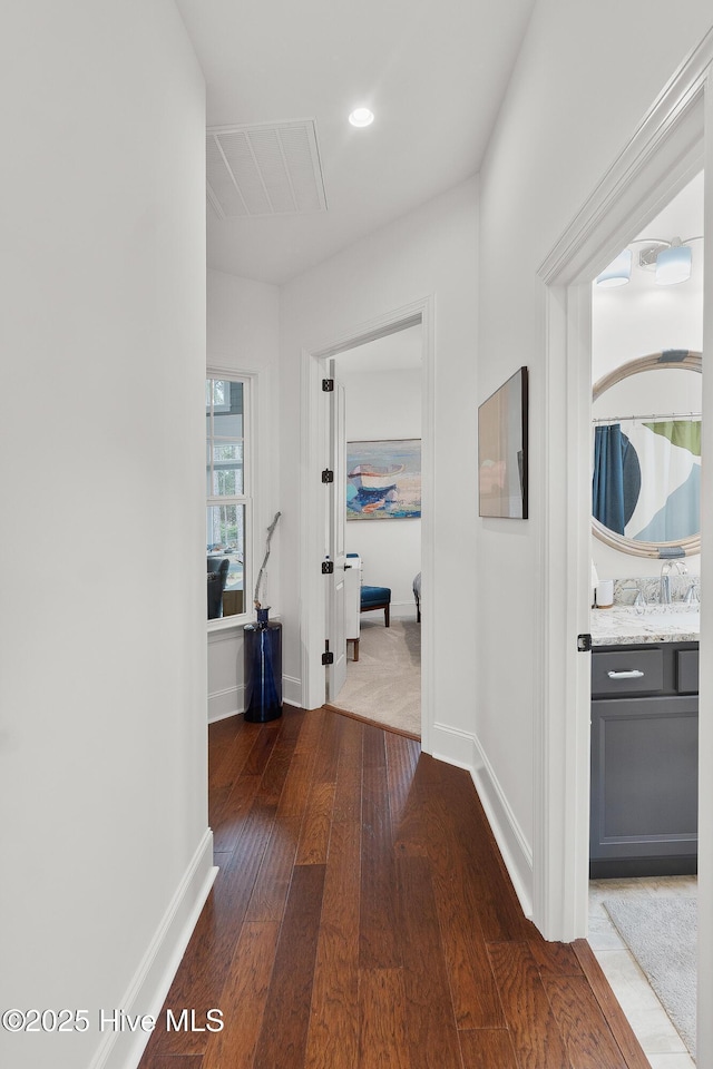 3752 Glenmere Ln, Southport, NC 28461 - hall with hardwood / wood-style flooring and baseboards