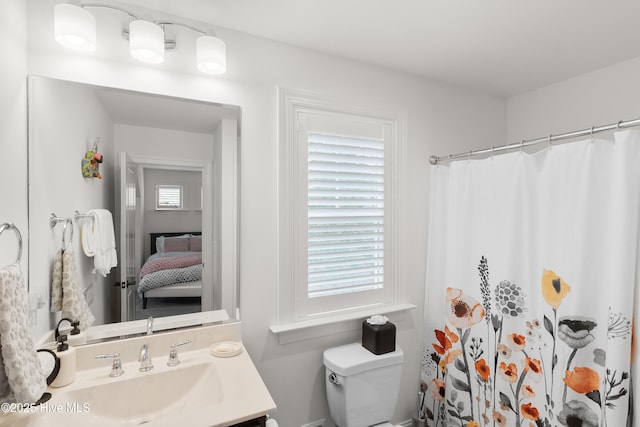 3752 Glenmere Ln, Southport, NC 28461 - ensuite bathroom with toilet, vanity, and curtained shower