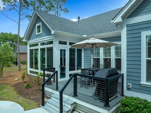 3752 Glenmere Ln, Southport, NC 28461 - wooden deck with a sunroom