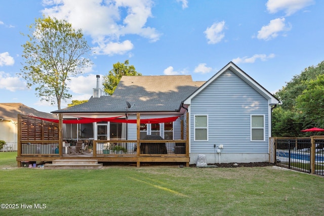 708 Cordgrass Rd, Hampstead, NC 28443 - rear view of property featuring a deck, a chimney, and a shingled roof