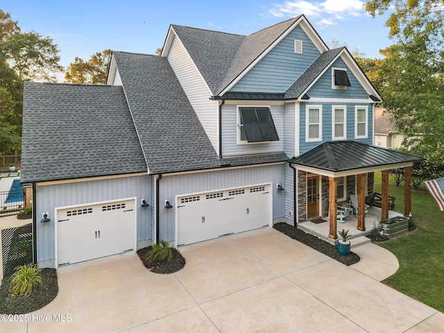 708 Cordgrass Rd, Hampstead, NC 28443 - view of front of property featuring a porch, driveway, roof with shingles, a standing seam roof, and cooling unit