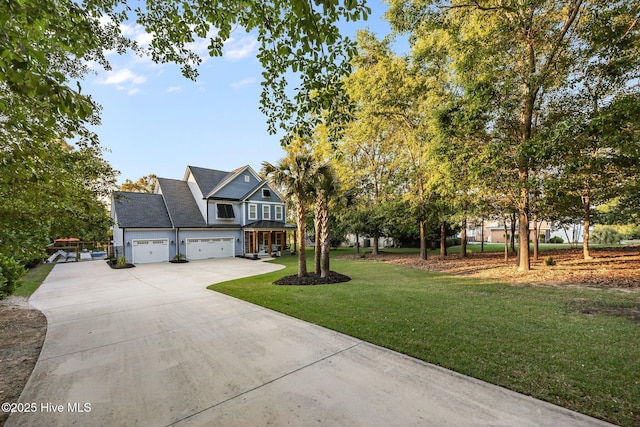 708 Cordgrass Rd, Hampstead, NC 28443 - craftsman inspired home with driveway, a front yard, and a garage