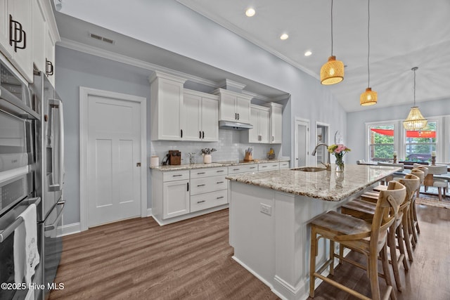 708 Cordgrass Rd, Hampstead, NC 28443 - kitchen featuring ornamental molding, a sink, recessed lighting, white cabinets, and dark wood-type flooring