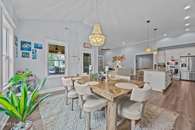 708 Cordgrass Rd, Hampstead, NC 28443 - dining room featuring dark wood finished floors, lofted ceiling, a chandelier, recessed lighting, and baseboards