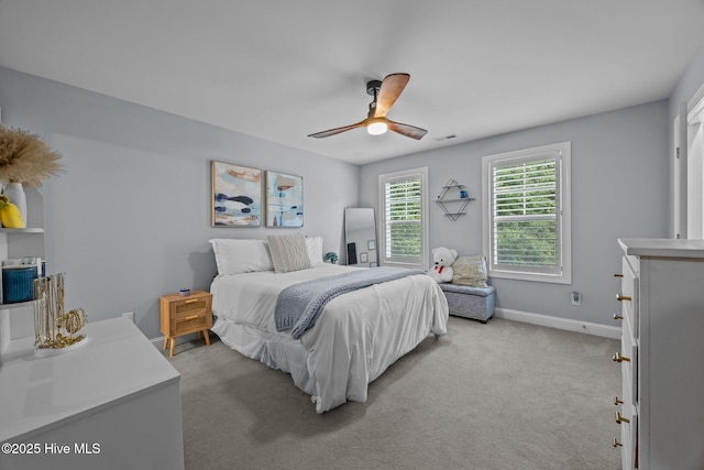 708 Cordgrass Rd, Hampstead, NC 28443 - bedroom featuring baseboards, light carpet, and ceiling fan