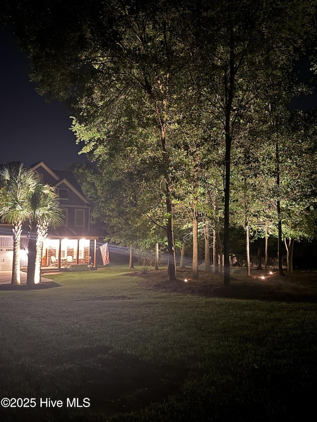 708 Cordgrass Rd, Hampstead, NC 28443 - yard at twilight with a lawn