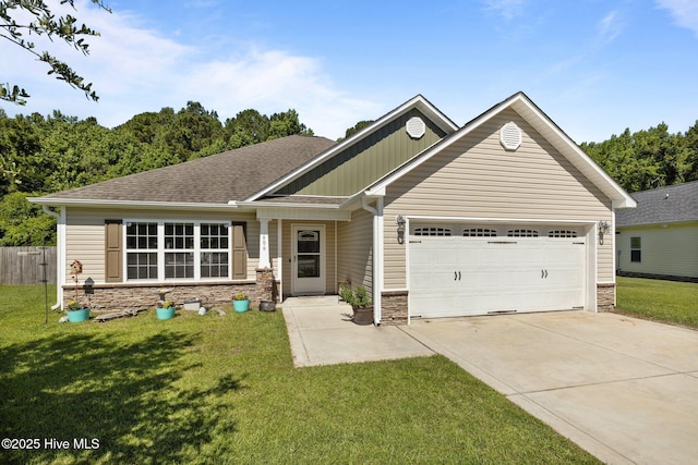 606 Spoleto Ct, Swansboro, NC 28584 - view of front of home with stone siding, a garage, and concrete driveway