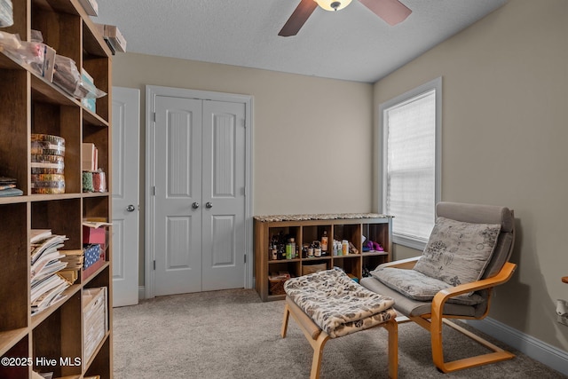 606 Spoleto Ct, Swansboro, NC 28584 - living area with a ceiling fan, carpet, a textured ceiling, and baseboards