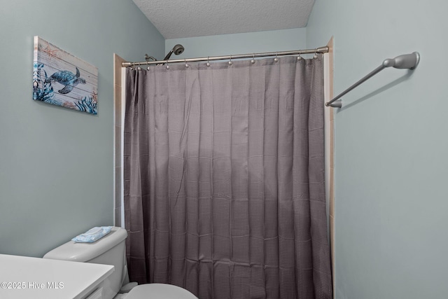 606 Spoleto Ct, Swansboro, NC 28584 - bathroom featuring toilet, a textured ceiling, vanity, and curtained shower