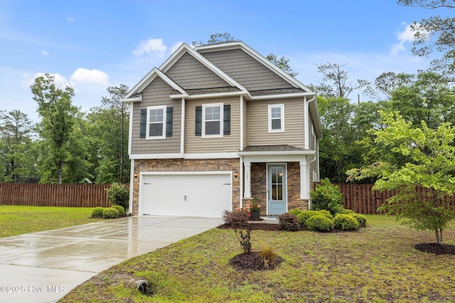 craftsman-style house featuring stone siding, driveway, and a garage