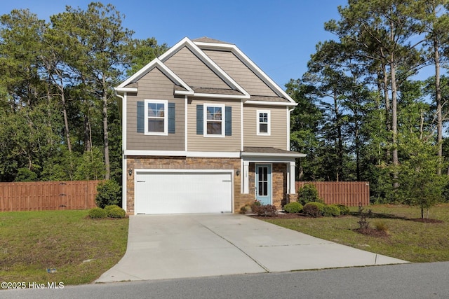 craftsman-style house with an attached garage and driveway