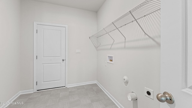laundry area featuring washer hookup, baseboards, light floors, hookup for an electric dryer, and gas dryer hookup