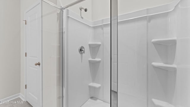 bathroom with a shower stall