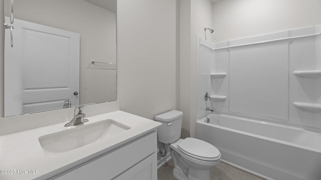 bathroom featuring toilet, vanity, and shower / bathtub combination