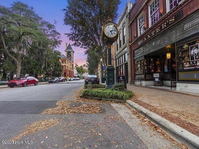 410 Isabelle St, New Bern, NC 28560 - view of asphalt street featuring curbs, sidewalks, and street lighting