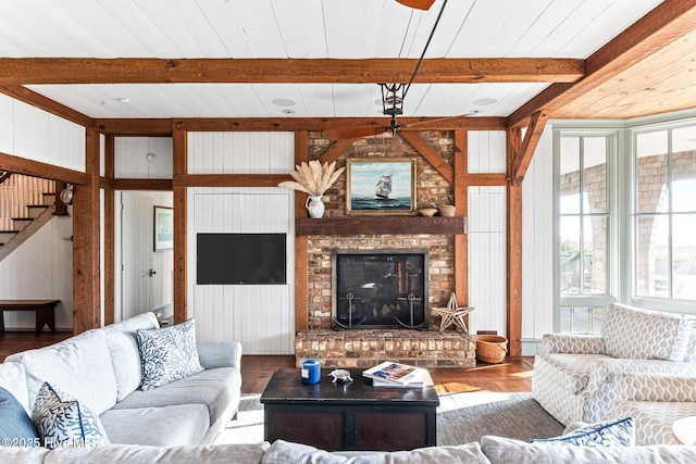 21 Sea Gull Trl, Bald Head Island, NC 28461 - living area with wood finished floors, beam ceiling, a ceiling fan, stairway, and a fireplace