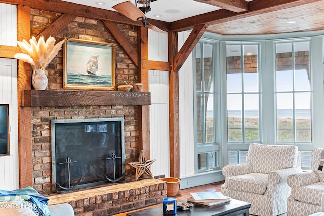 21 Sea Gull Trl, Bald Head Island, NC 28461 - living room with a brick fireplace, wood finished floors, and beamed ceiling