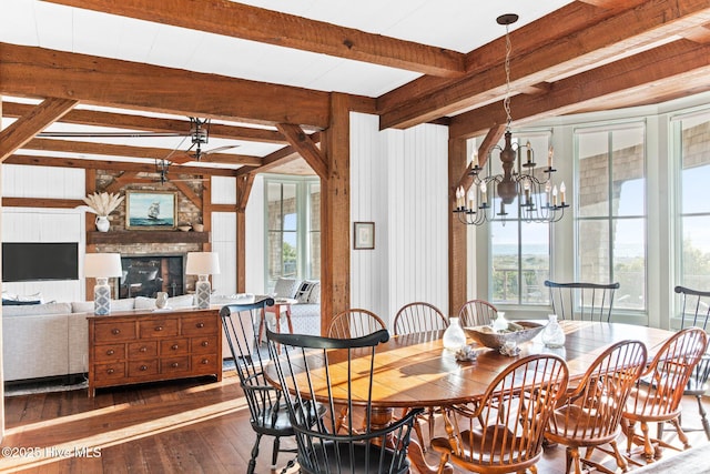 21 Sea Gull Trl, Bald Head Island, NC 28461 - dining area featuring wood-type flooring, plenty of natural light, beamed ceiling, a chandelier, and a fireplace