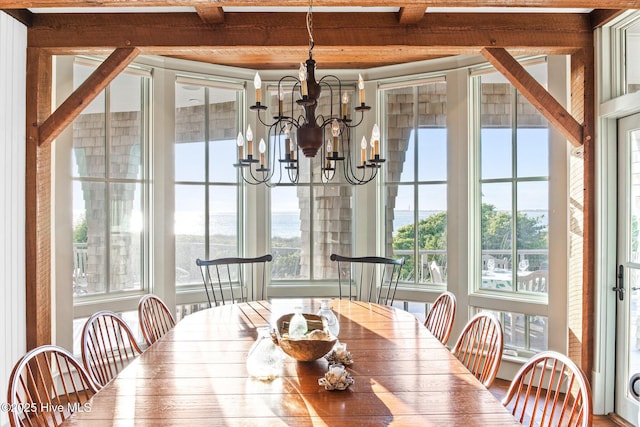 21 Sea Gull Trl, Bald Head Island, NC 28461 - dining space with a chandelier and beam ceiling