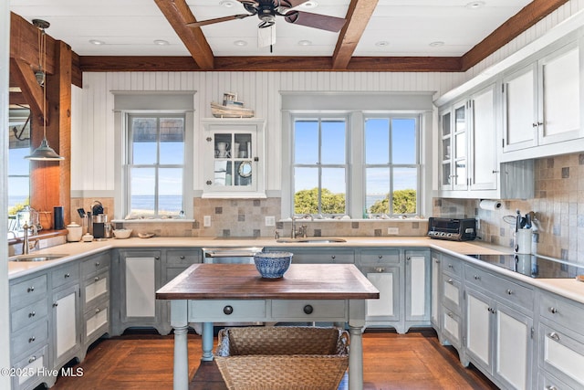 21 Sea Gull Trl, Bald Head Island, NC 28461 - kitchen featuring a sink, healthy amount of natural light, beamed ceiling, a ceiling fan, and coffered ceiling
