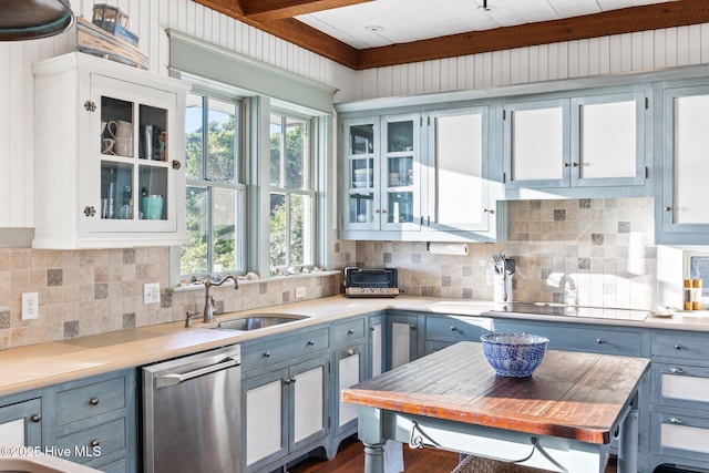21 Sea Gull Trl, Bald Head Island, NC 28461 - kitchen with stainless steel dishwasher, a sink, light countertops, and decorative backsplash