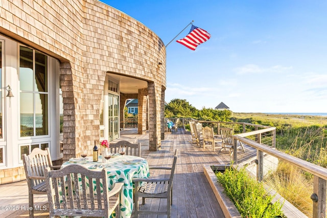 21 Sea Gull Trl, Bald Head Island, NC 28461 - wooden terrace with outdoor dining area