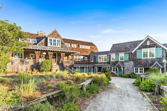 21 Sea Gull Trl, Bald Head Island, NC 28461 - shingle-style home with a chimney, a standing seam roof, and driveway