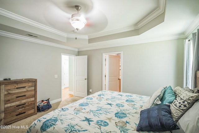 239 Shellbank Dr, Sneads Ferry, NC 28460 - bedroom featuring a raised ceiling, crown molding, light carpet, and a ceiling fan