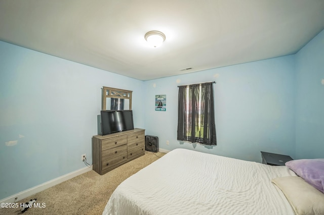 239 Shellbank Dr, Sneads Ferry, NC 28460 - bedroom featuring light carpet and baseboards