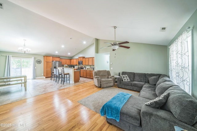 239 Shellbank Dr, Sneads Ferry, NC 28460 - living area with a chandelier, light wood finished floors, lofted ceiling, ceiling fan, and recessed lighting