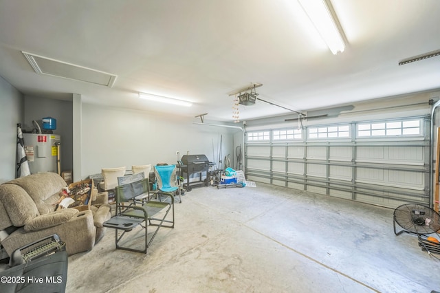 239 Shellbank Dr, Sneads Ferry, NC 28460 - garage with water heater and a garage door opener