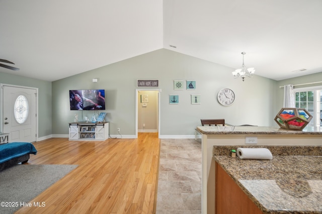 239 Shellbank Dr, Sneads Ferry, NC 28460 - living room with vaulted ceiling, a chandelier, baseboards, and light wood-style floors
