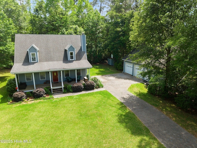 cape cod-style house featuring a porch, an outdoor structure, a front yard, and a chimney