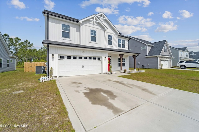 view of front of house with board and batten siding, concrete driveway, an attached garage, a porch, and central AC unit